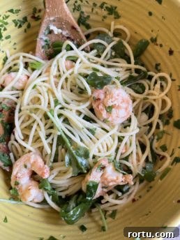 grilled shrimp pasta in a yellow bowl