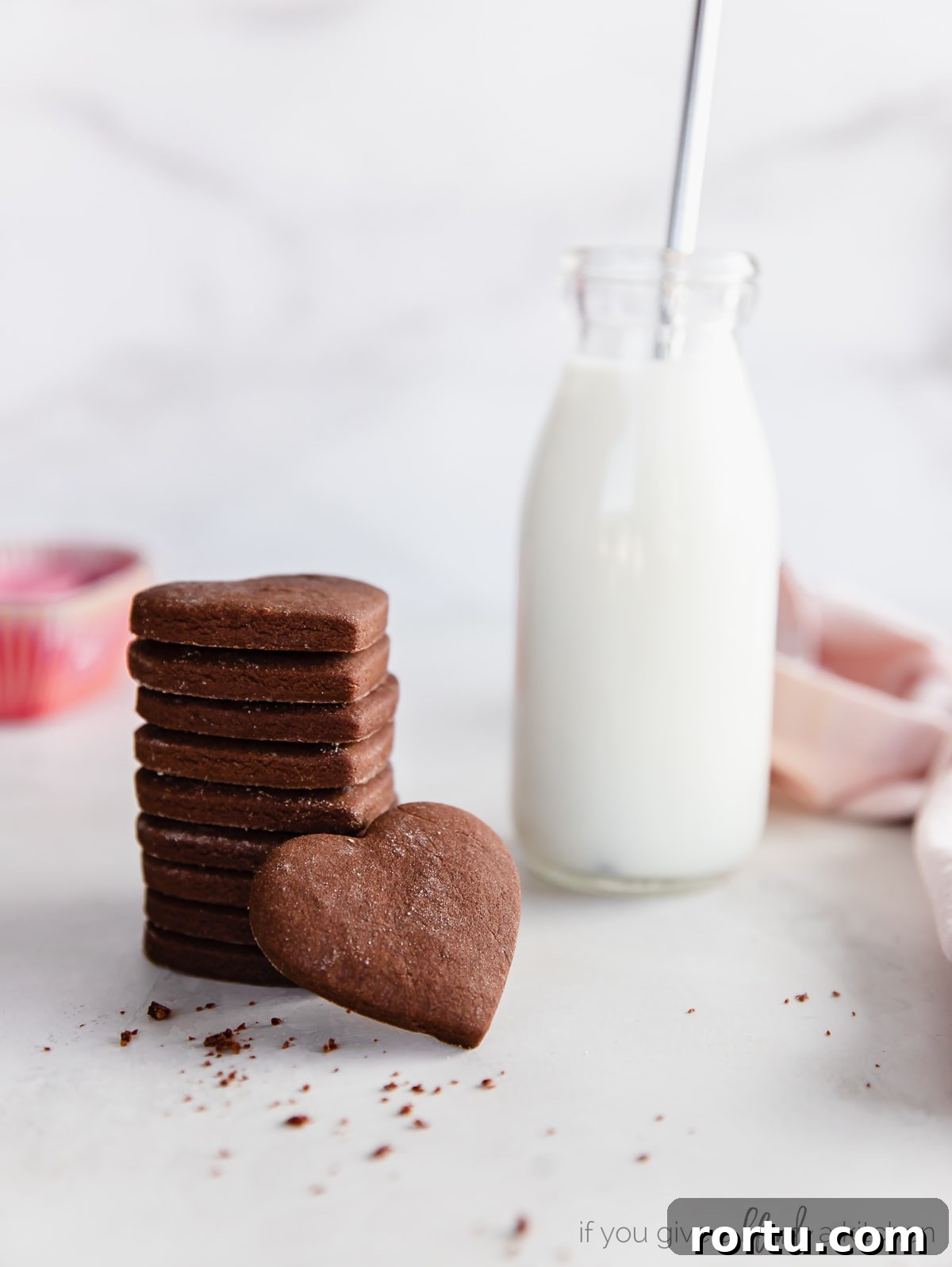 Chocolate Cut-Out Cookies: Perfect Decorated Cocoa Sugar Cookies 5 stack of chocolate cut out cookies next to glass jar of milk