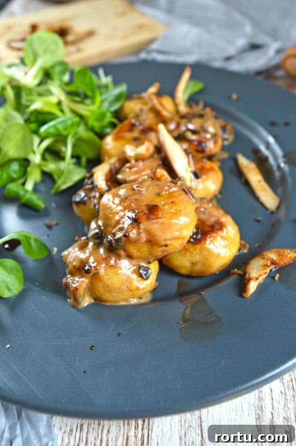 Round gnocchi with a brown sauce