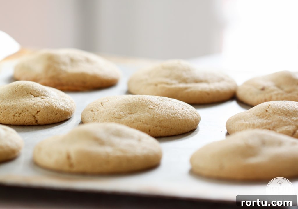 stuffed peanut butter cookies on a baking sheet.