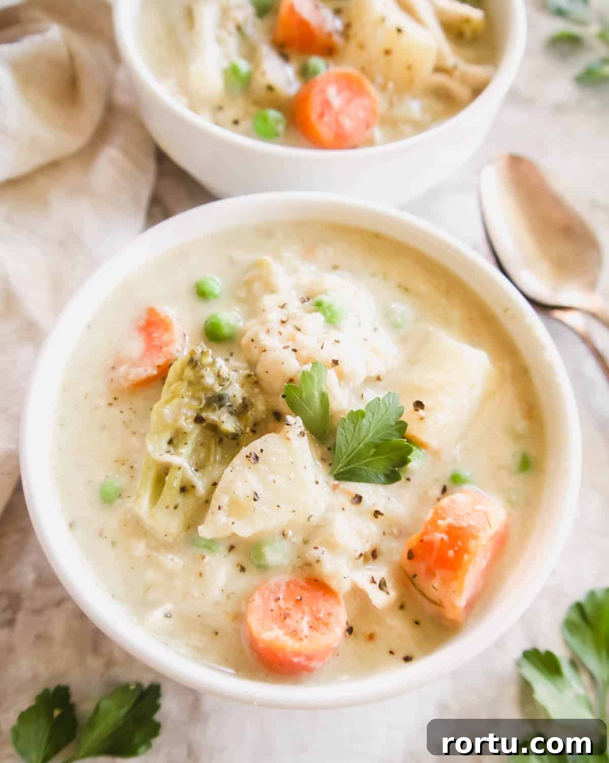 Slow Cooker Chicken Pot Pie Soup — Whole30, Paleo, Dairy-Free 2 Slow Cooker Healthy Chicken Pot Pie Soup in a bowl.