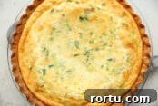 Easy Salmon Quiche in a glass pie dish.