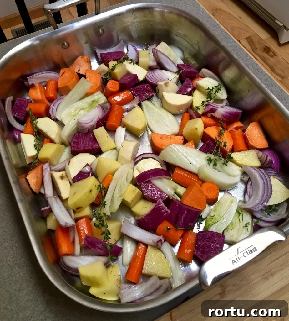Crisp Roast Chicken with Honey-Glazed Root Vegetables 3 Root vegetables in roasting pan.