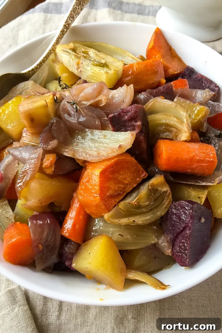 Crisp Roast Chicken with Honey-Glazed Root Vegetables 4 Close up of roasted root vegetables in bowl.