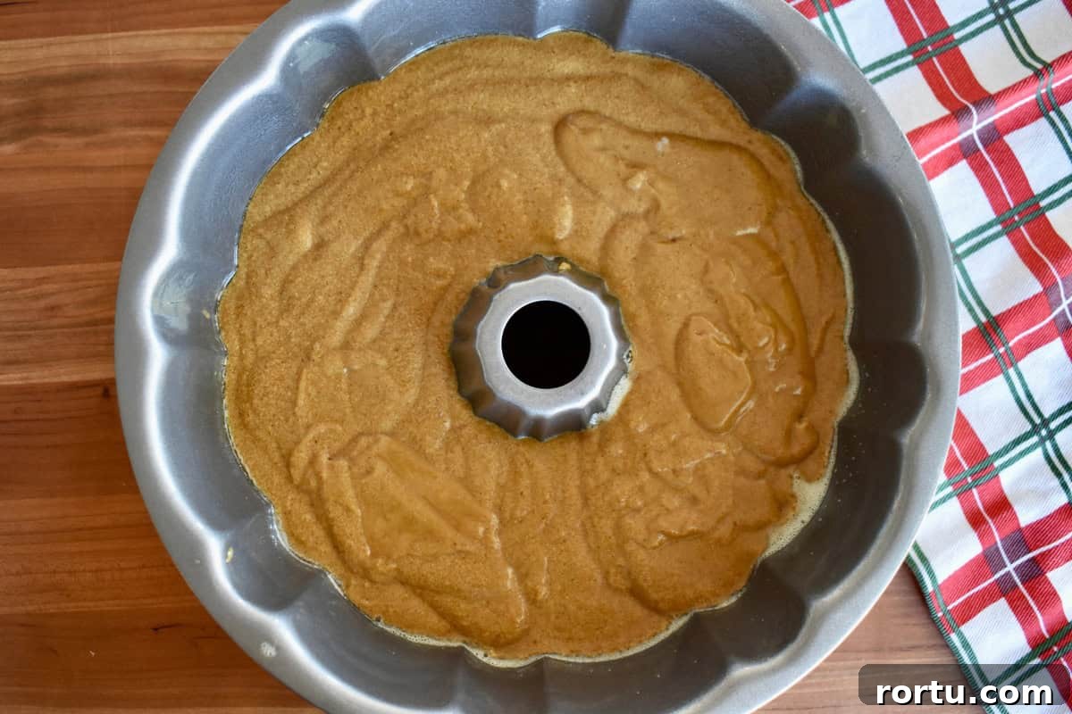 Maple-Glazed Gingerbread Bundt Cake Recipe for Holiday Baking 6 Batter poured into pan.