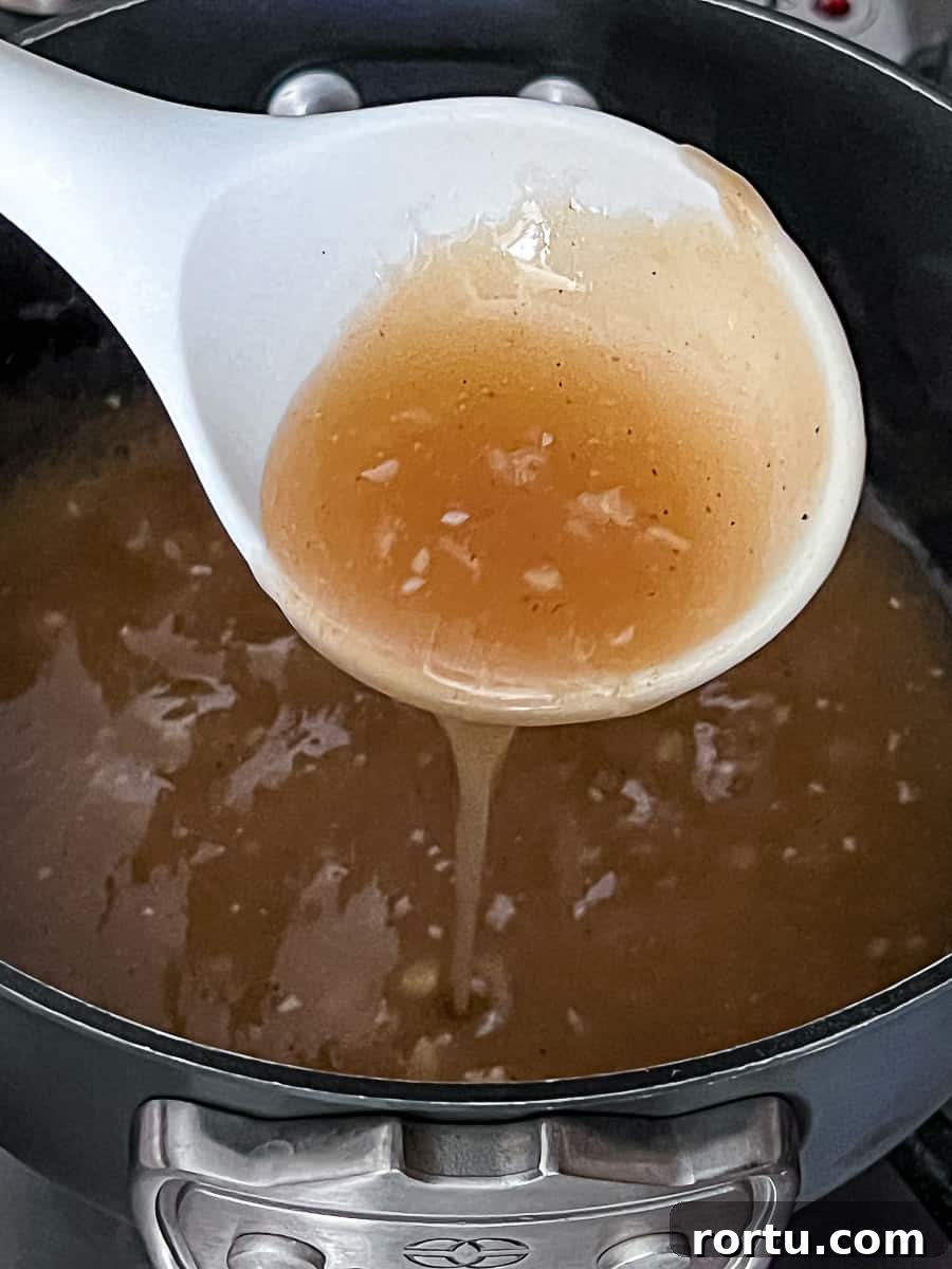Turkey Gravy Packet Recipe made with garlic in a pan on the stove