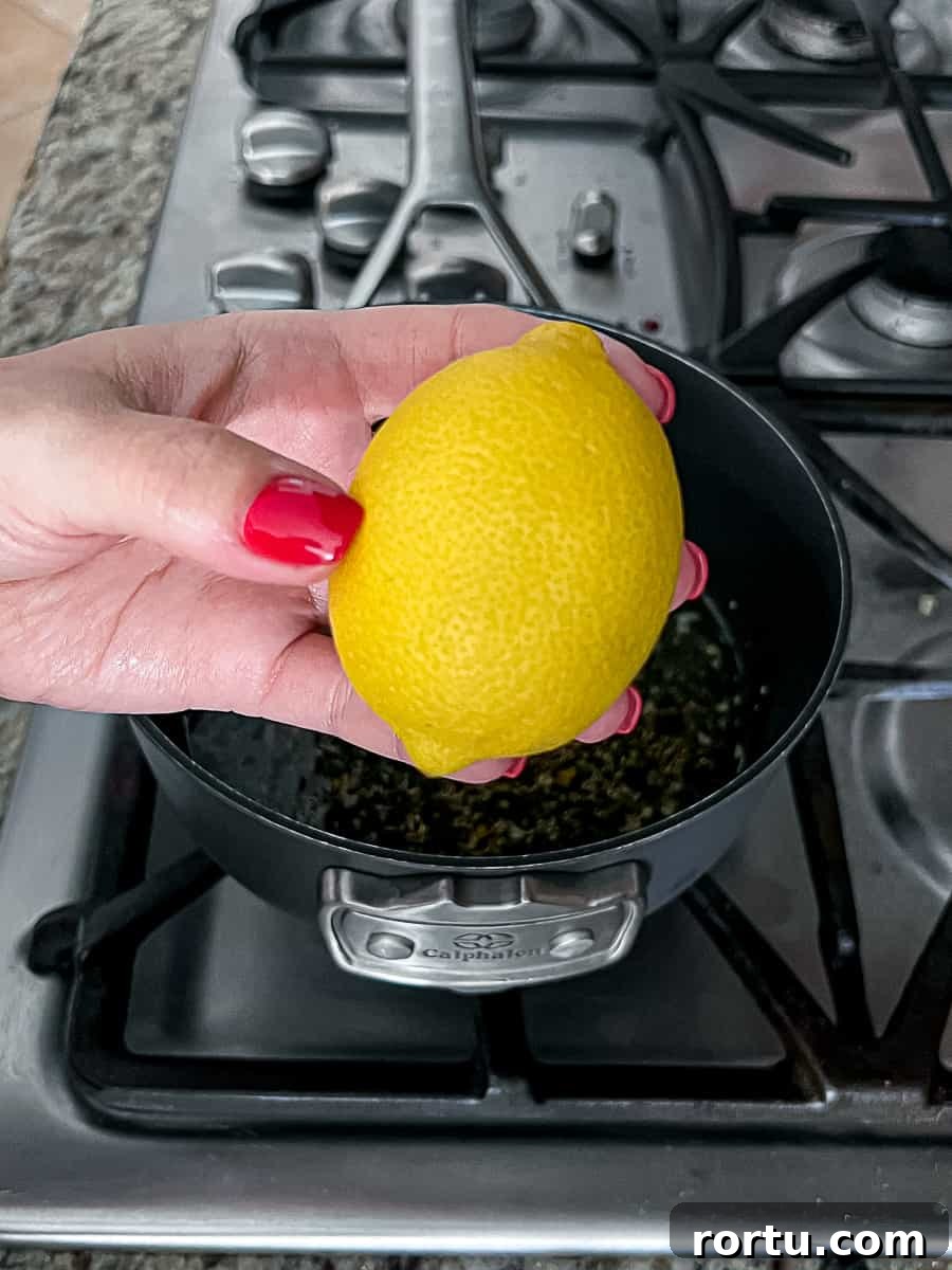 Holding a fresh lemon while making turkey gravy packet recipe