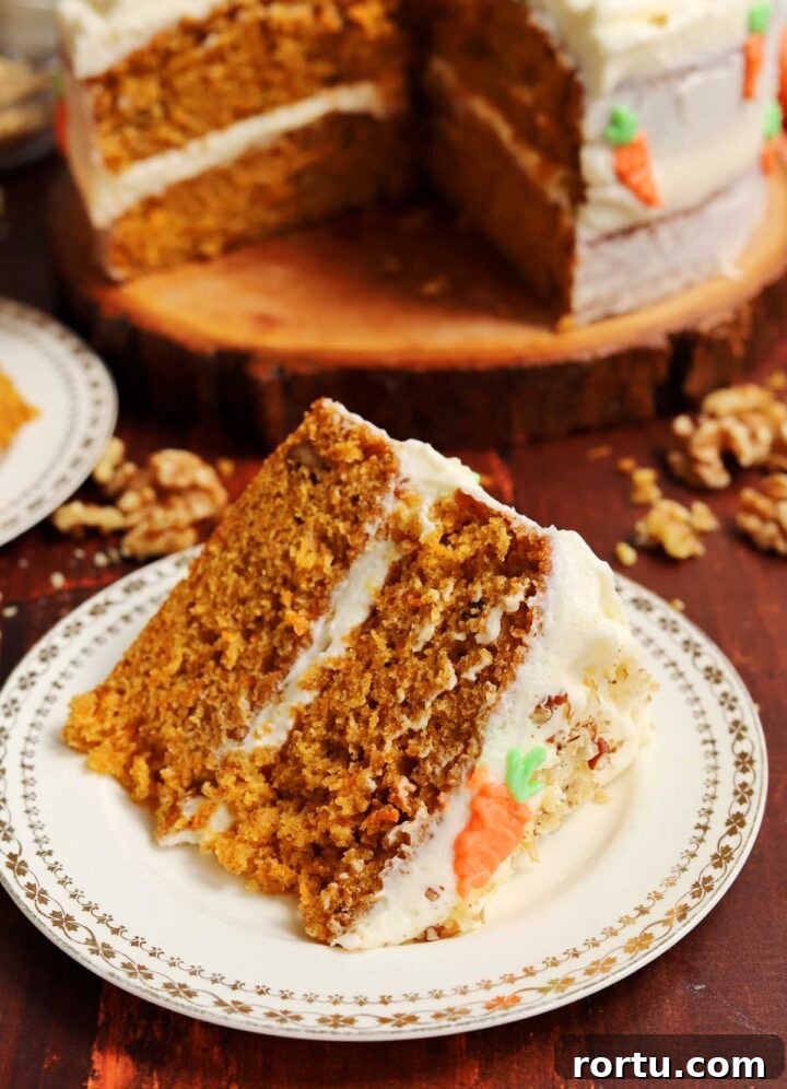 Ultimate Carrot Cake with Light Fluffy Cream Cheese Frosting 3 best carrot cake slice on plate