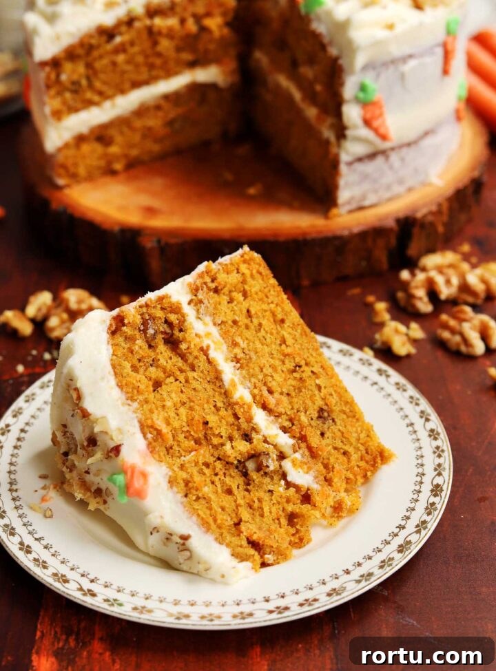 Ultimate Carrot Cake with Light Fluffy Cream Cheese Frosting 25 best carrot cake slice on plate