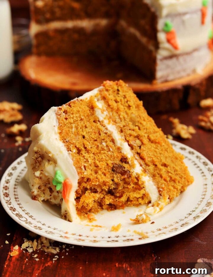 Ultimate Carrot Cake with Light Fluffy Cream Cheese Frosting 26 best carrot cake slice on plate