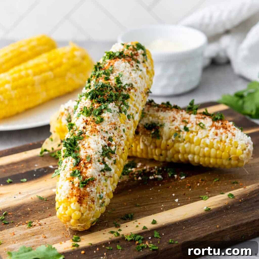 elotes Mexican street corn on wooden cutting board