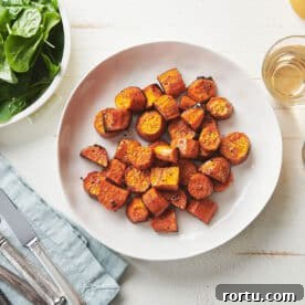 White plate of Butter-Roasted Sweet Potatoes