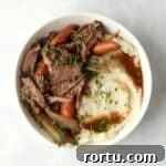bowl of pot roast with mashed potatoes