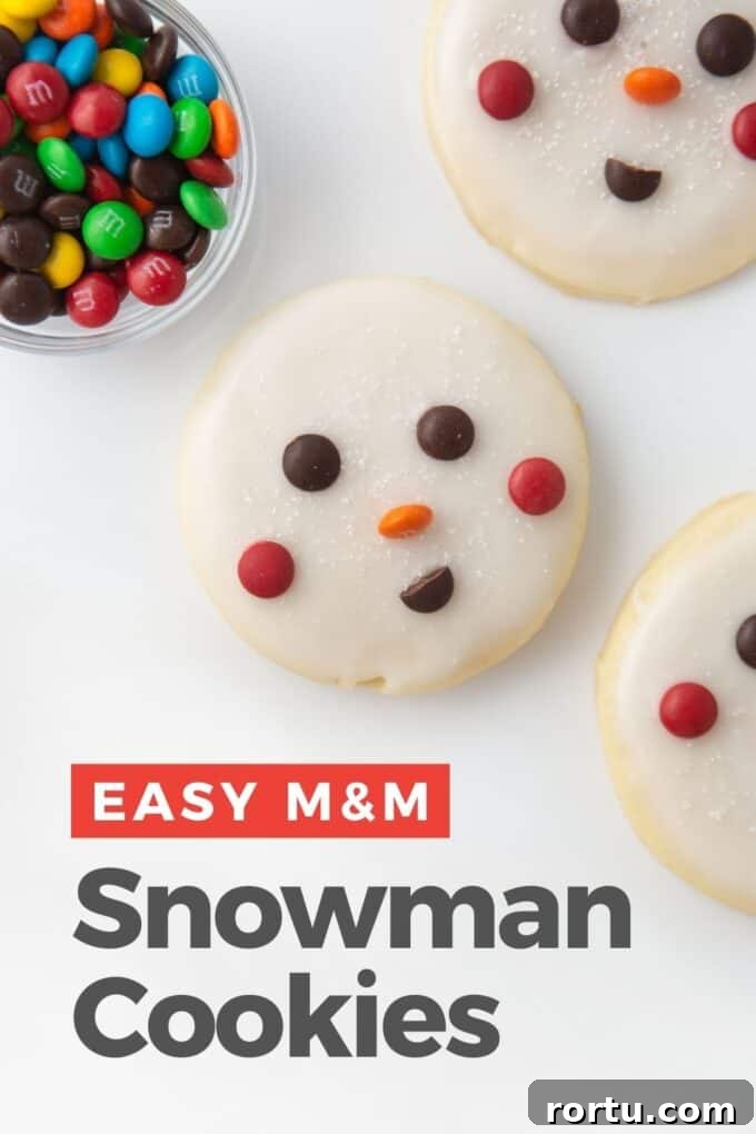 decorated snowman cookie with M&M face