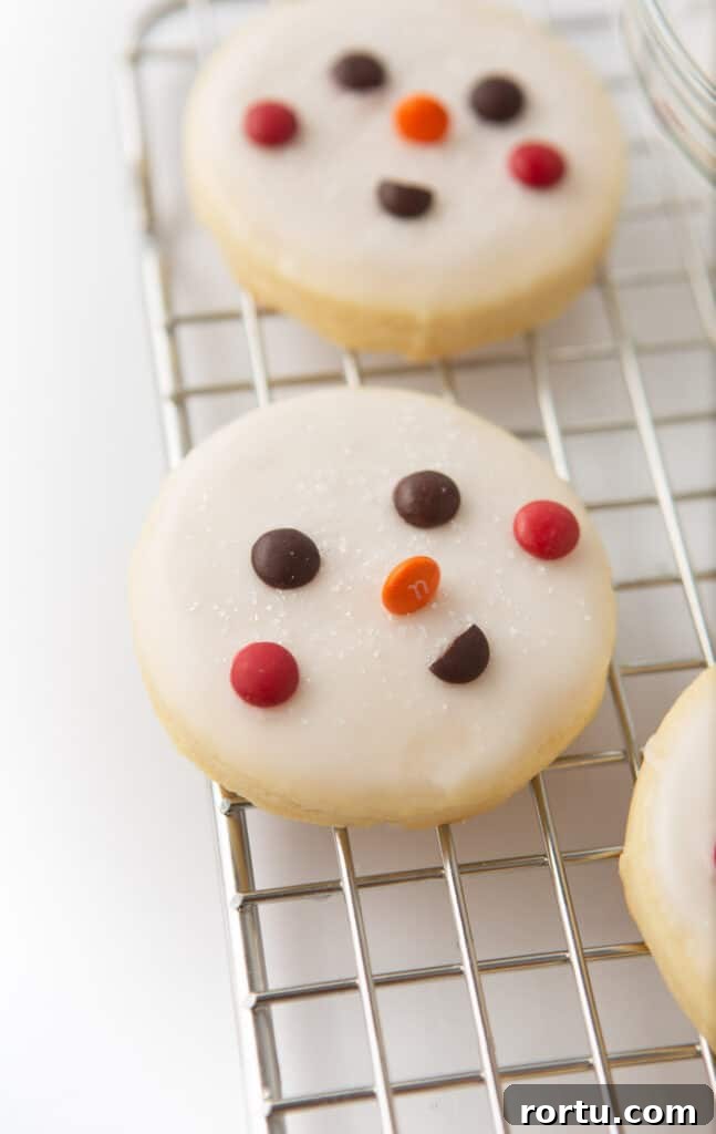 decorated snowman cookie with M&M face