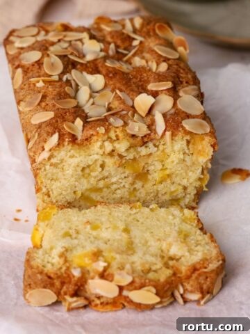 A loaf of mango bread sliced.