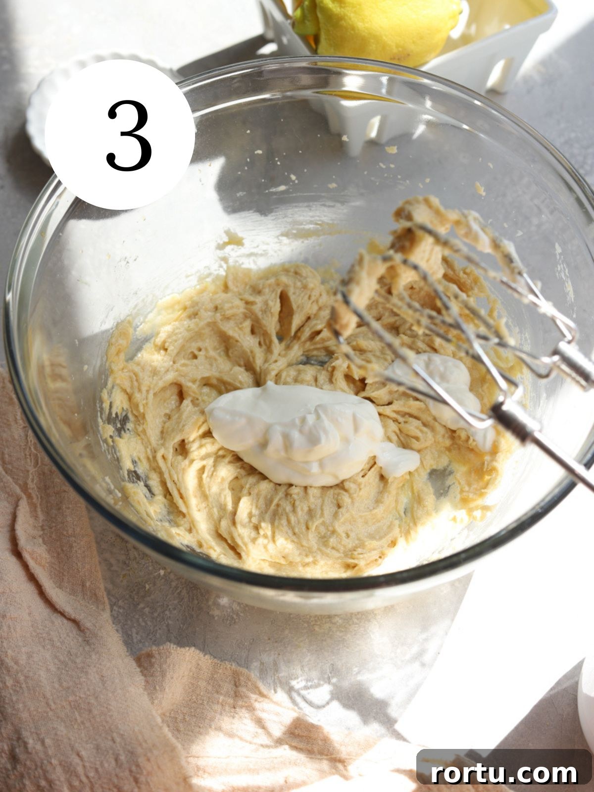 Lemon White Chocolate Cookie Recipe: Zesty Homemade Treat 6 Sour cream being added to dough