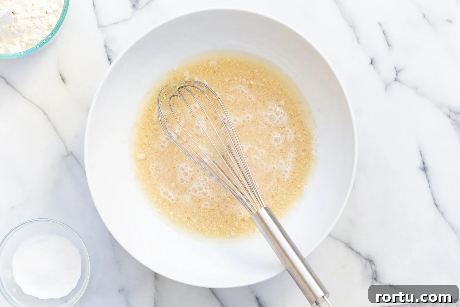 Moist Vegan Pear Upside-Down Cake Recipe 7 Cake batter for Our Vegan Pear Upside Down Cake in a white bowl