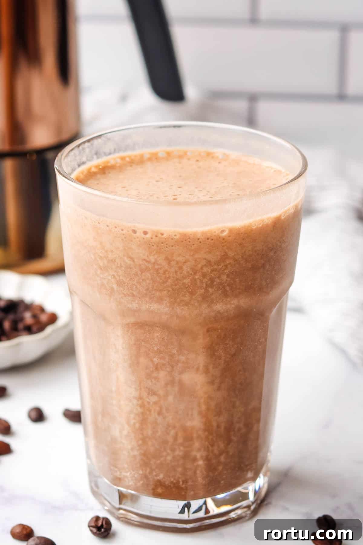Energizing Banana Coffee Smoothie Recipe for Morning Boost 2 A tall glass of coffee banana smoothie.