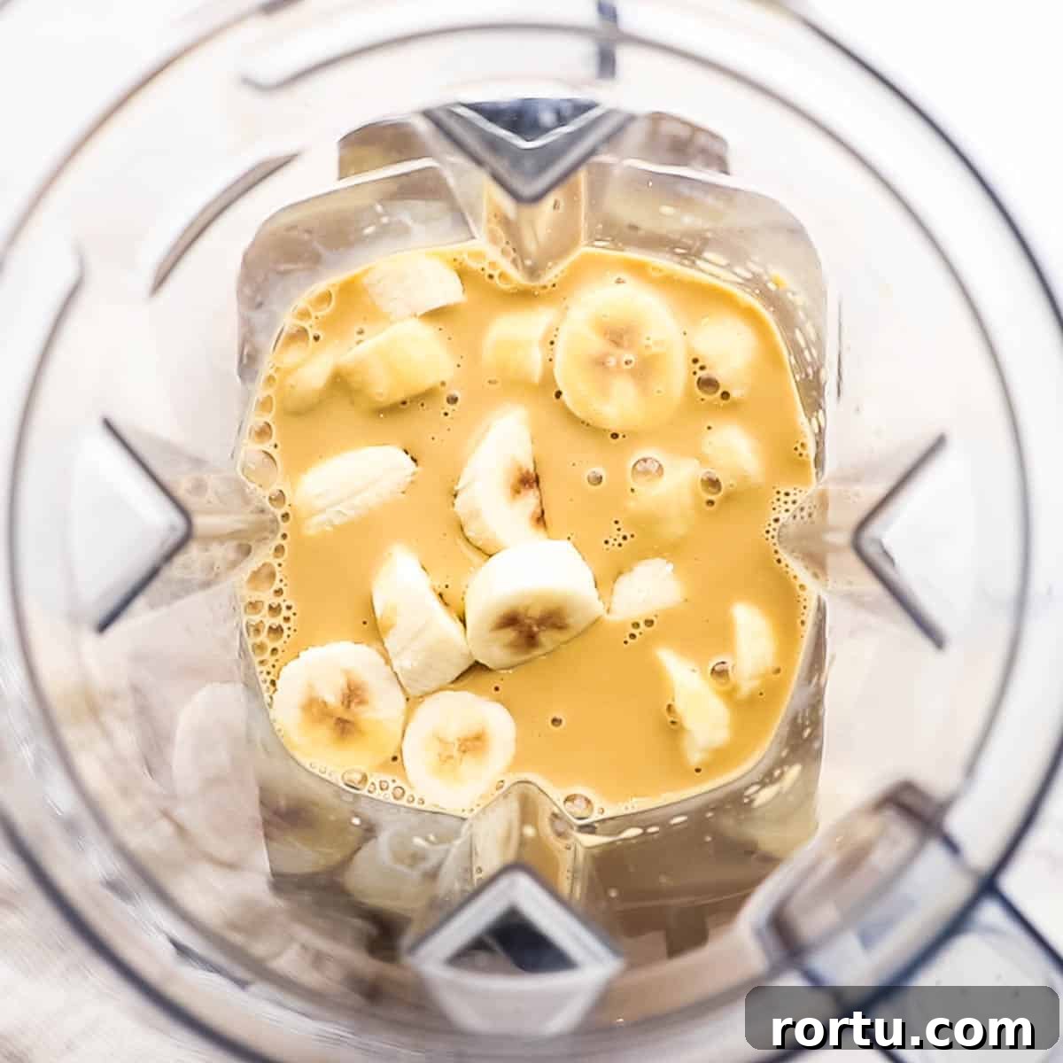 Energizing Banana Coffee Smoothie Recipe for Morning Boost 5 banana, coffee, milk and other ingredients added to a blender