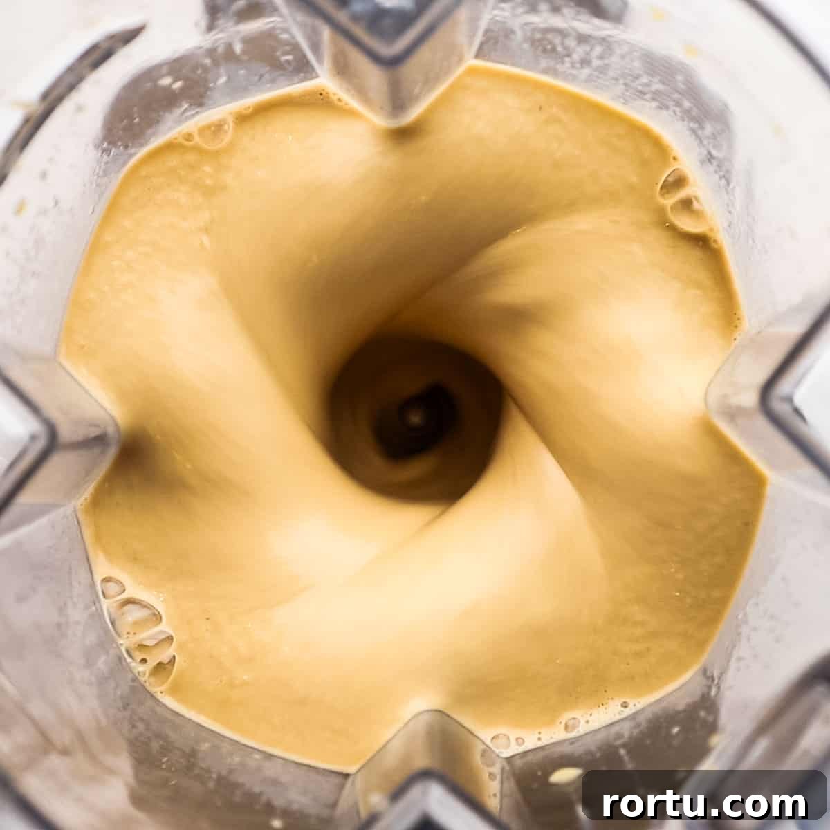 Energizing Banana Coffee Smoothie Recipe for Morning Boost 6 overhead view of coffee banana smoothie being blended