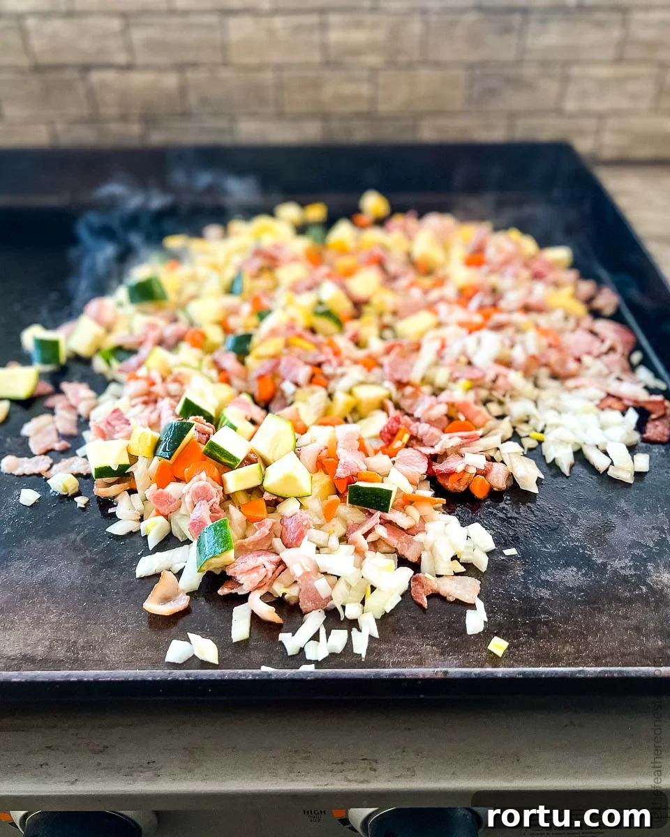 diced vegetables cooking on the Blackstone Griddle.