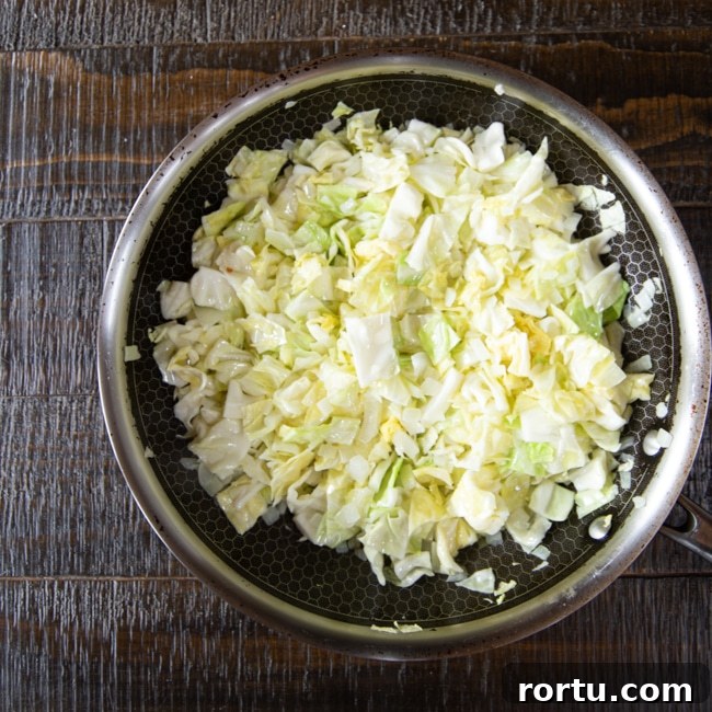 Colcannon Recipe: Traditional Irish Mashed Potatoes with Cabbage 3 A skillet of freshly sautéed onions and cabbage.
