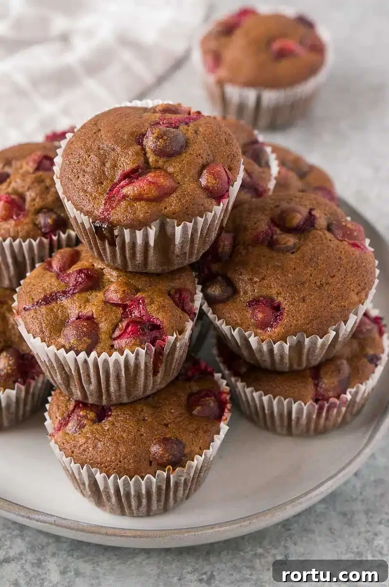 orange cranberry muffins on a plate