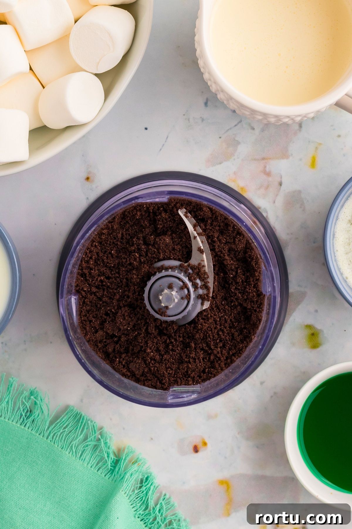 Creamy Mint Grasshopper Pie Recipe That Impresses 5 Chocolate cookies crumbled in a food processor before putting in the pie dish.