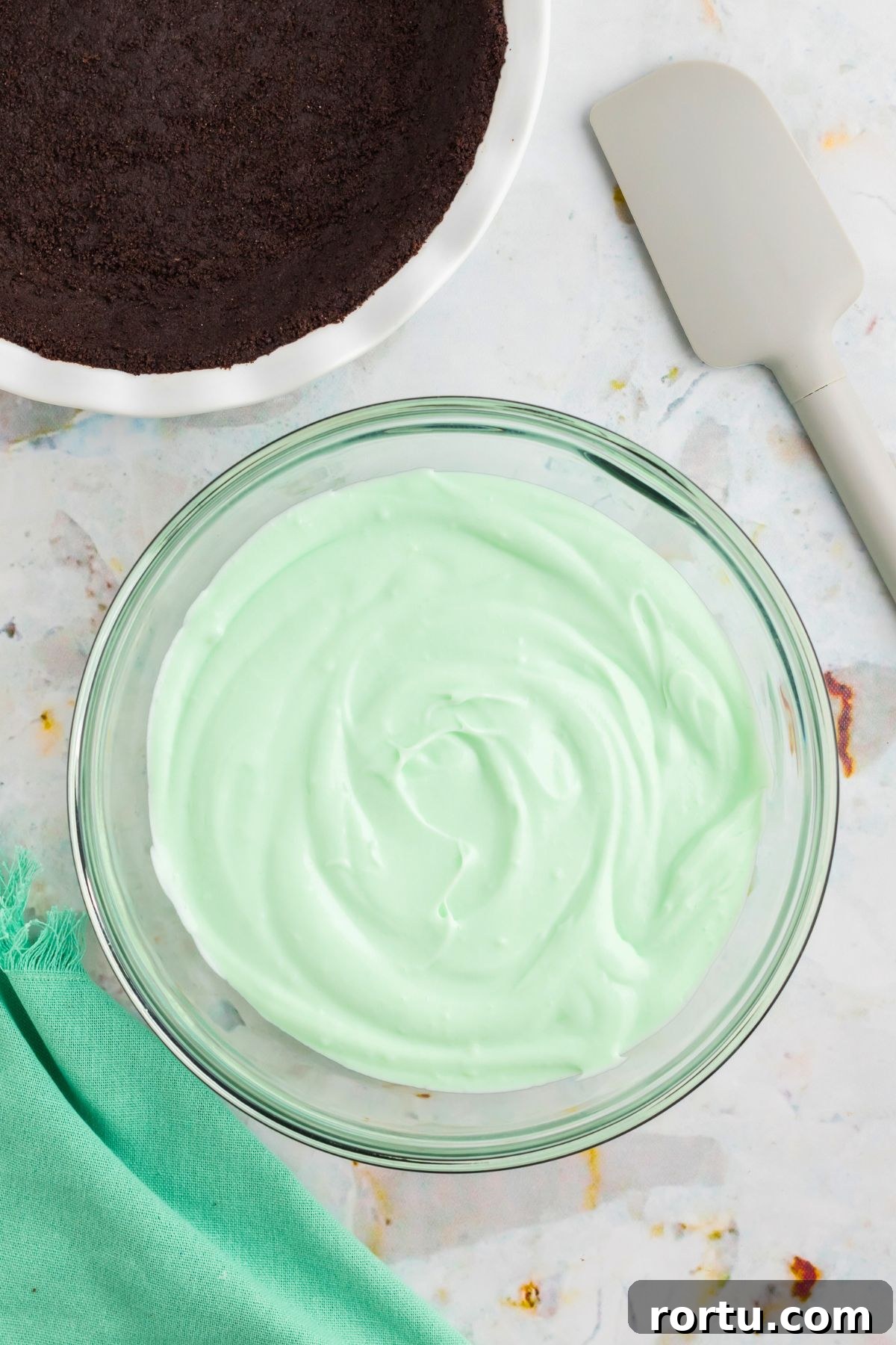 Creamy Mint Grasshopper Pie Recipe That Impresses 8 Mint flavoring syrup mixed in with melted marshmallows and cream.