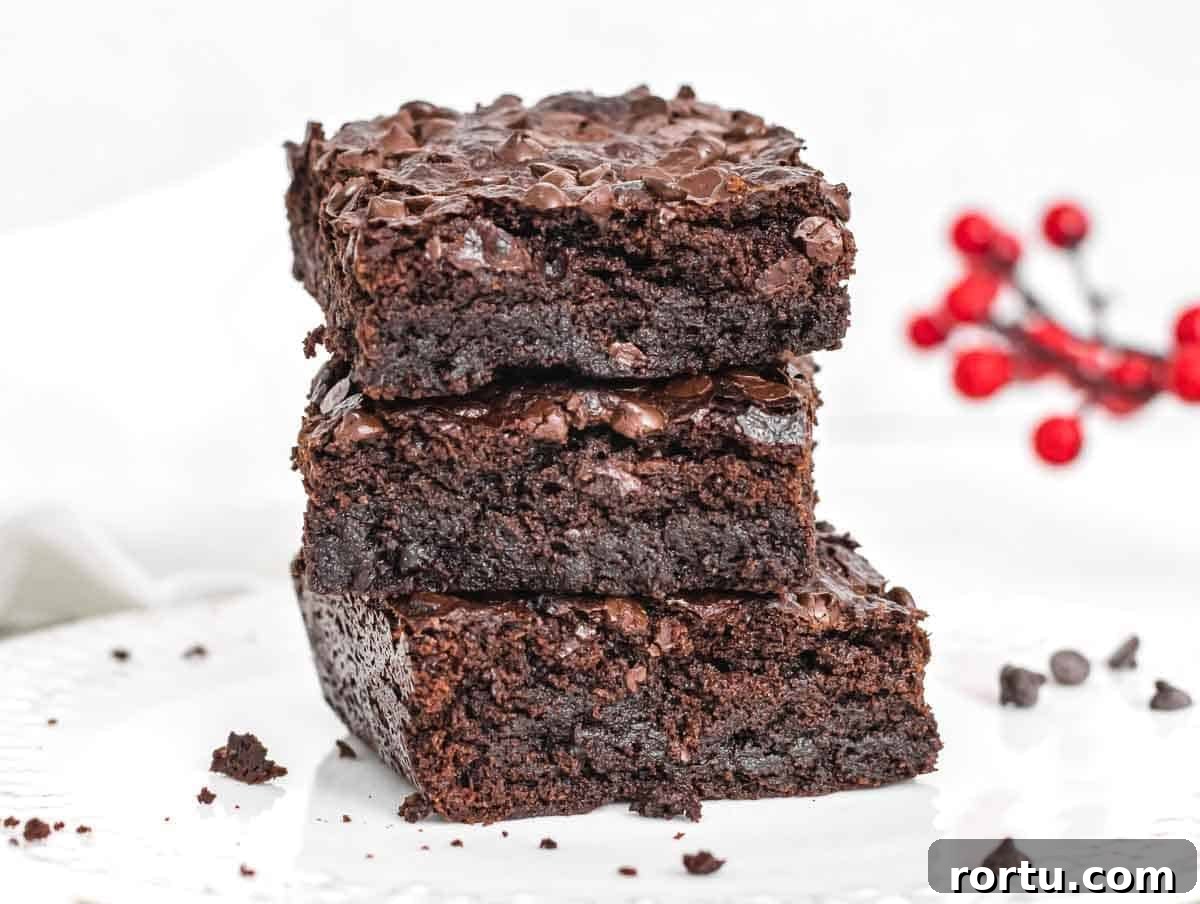 Vegan brownies stacked on a plate