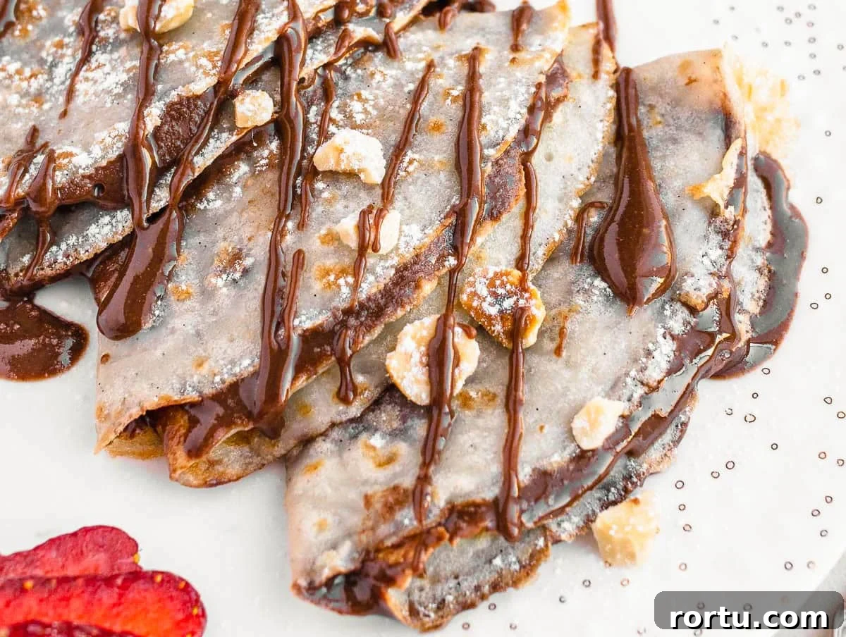 Vegan crepes with hazelnut spread and powdered sugar