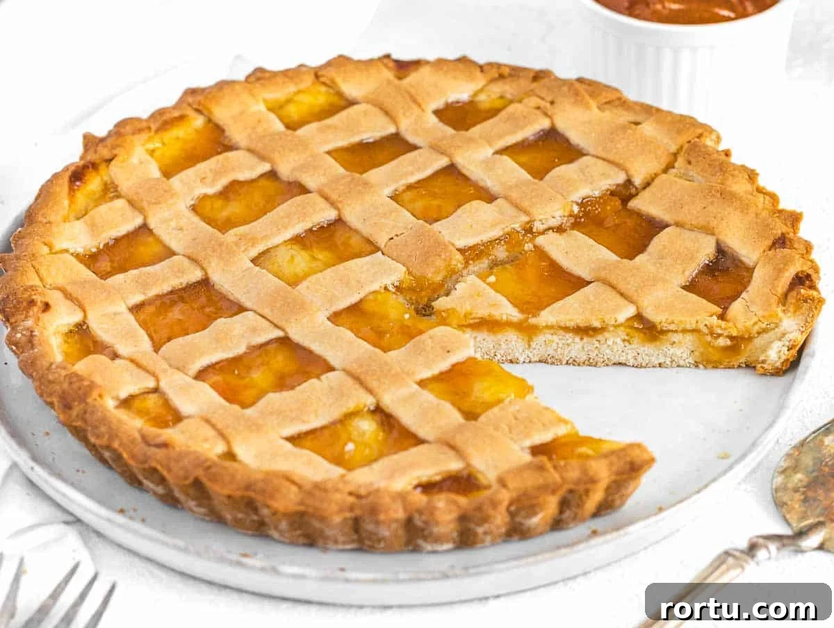 Crostata with slice on a white plate