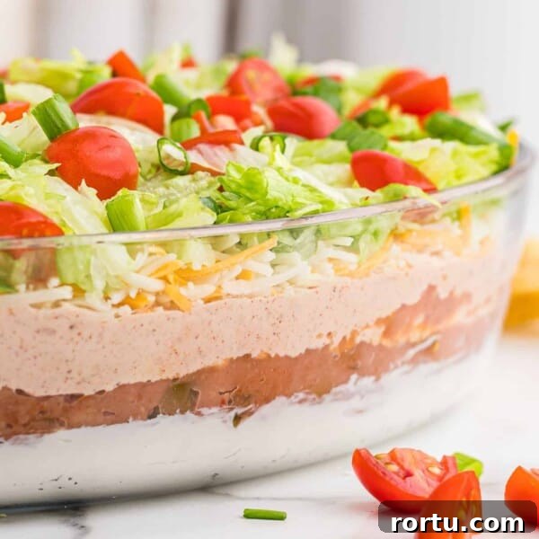 Straight on image of 7 layer dip to show layers in glass dish.