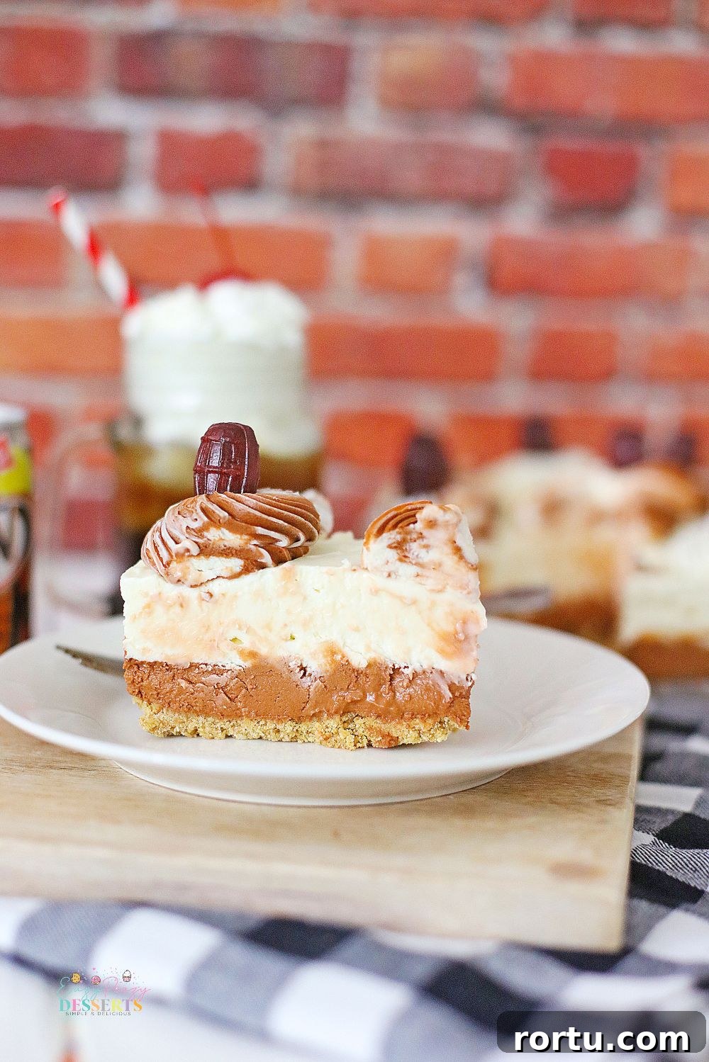 Root Beer Cheesecake Recipe: Creamy Dessert with Fizzy Flavor 4 Front image of a slice of root beer float cheese on a dessert plate