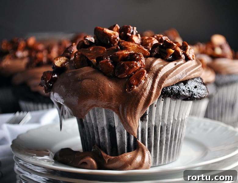Best chocolate cupcake recipe | homemade chocolate cupcake recipe with amaretto pastry cream and almond pralines | ofbatteranddough.com