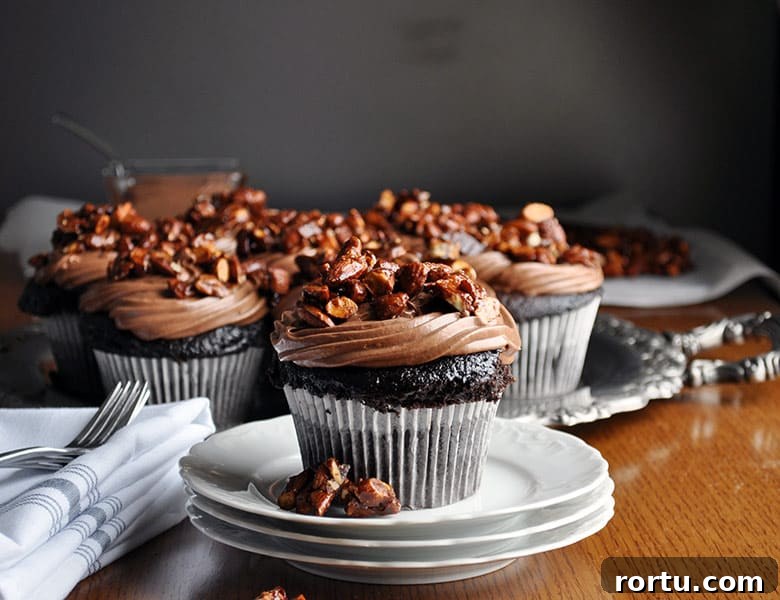 Best chocolate cupcake recipe | ultra moist chocolate cupcake recipe with amaretto pastry cream and almond pralines | ofbatteranddough.com