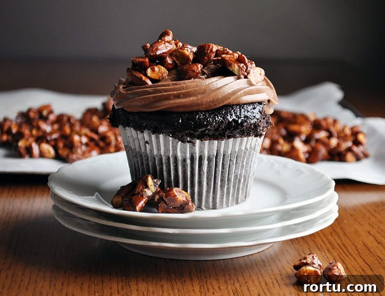 Best homemade chocolate cupcake recipe | ultra moist chocolate cupcake recipe with amaretto pastry cream and almond pralines | ofbatteranddough.com