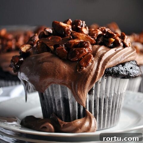 Best chocolate cupcake recipe | homemade chocolate cupcake recipe with amaretto pastry cream and almond pralines | ofbatteranddough.com