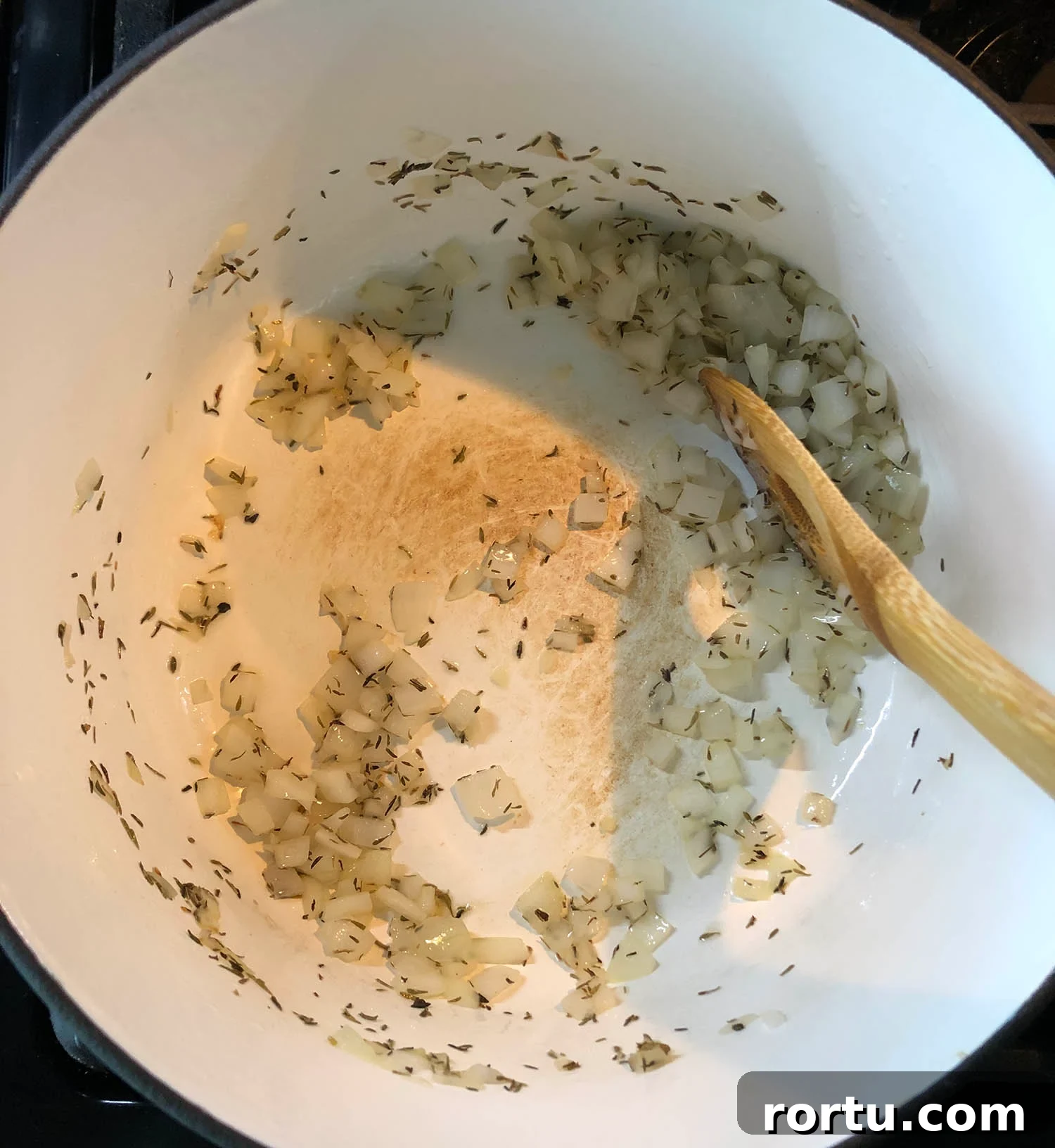 Creamy Corn Chowder Made with Frozen Corn 3 onion cooking in a pot