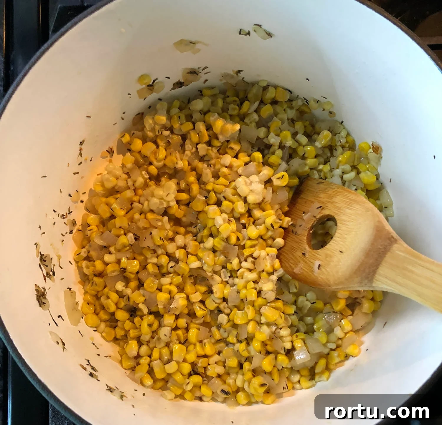 Creamy Corn Chowder Made with Frozen Corn 4 corn cooking in a pot