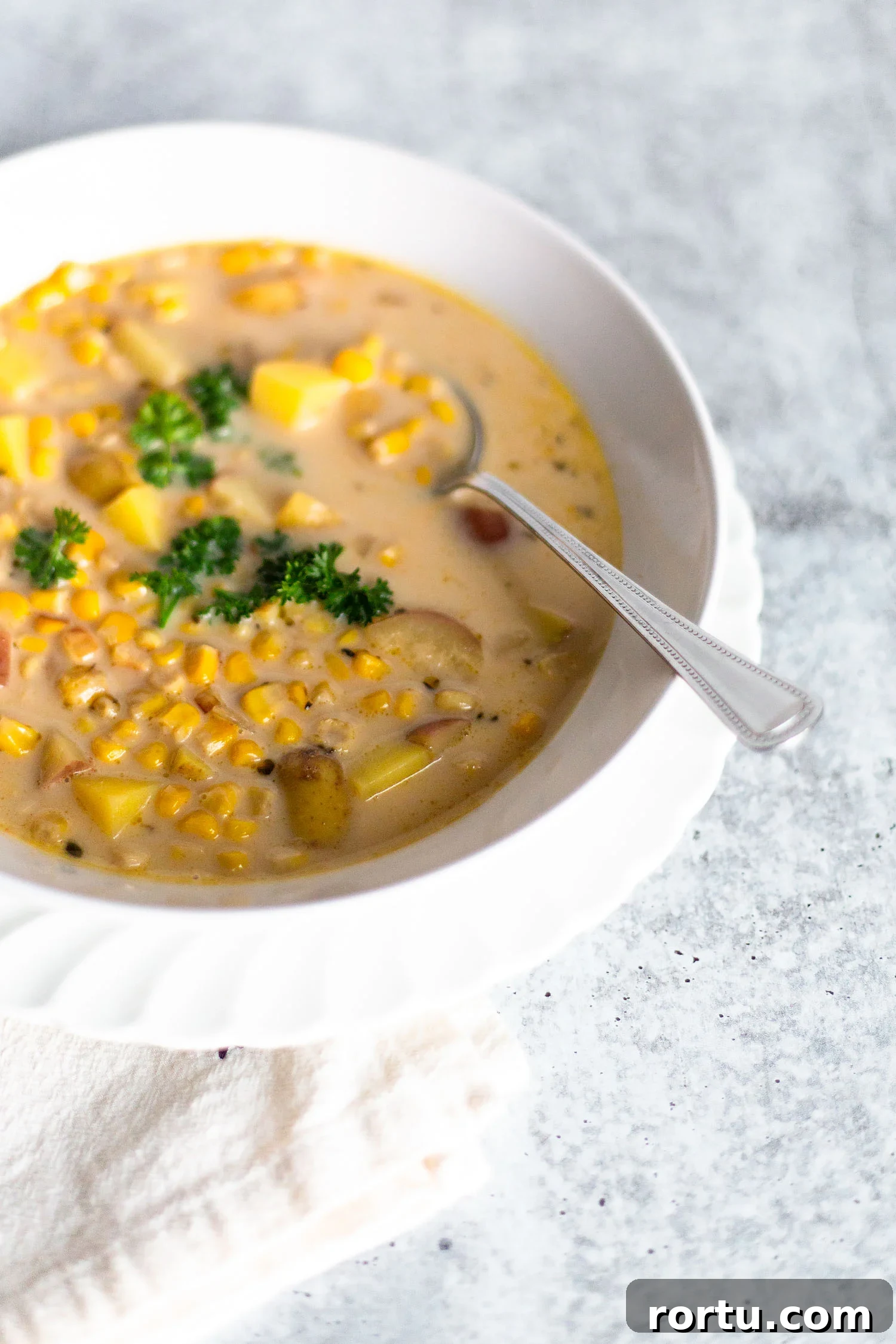 Creamy Corn Chowder Made with Frozen Corn 7 frozen corn chowder with a spoon
