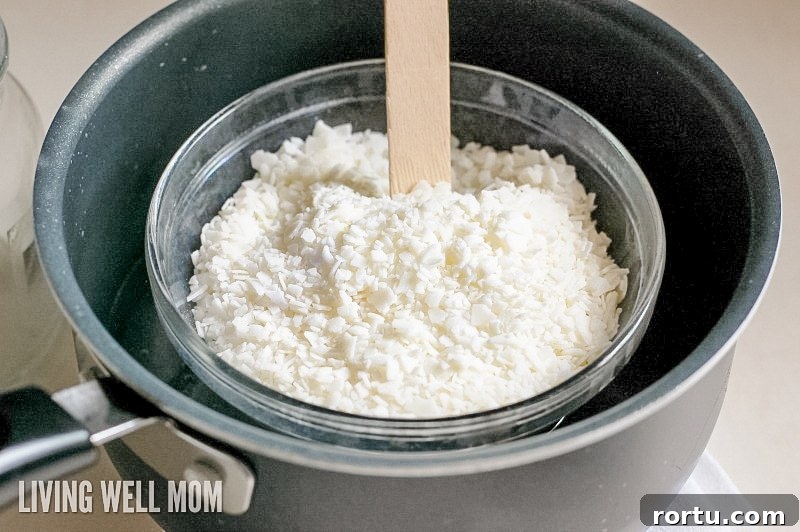 Make Homemade Citronella Candles to Repel Mosquitoes 5 wax pellets being melted in a make-shift double boiler