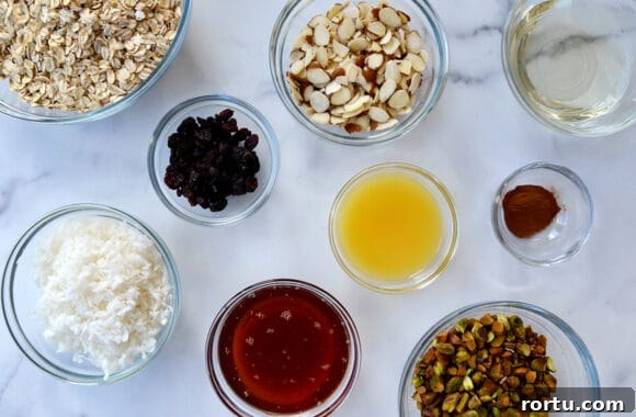Orange Honey Granola Parfaits with Greek Yogurt and Citrus Crunch 3 Glass bowls containing the ingredients for homemade granola