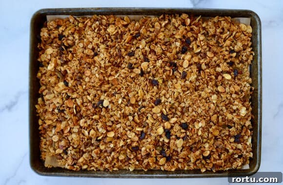 Orange Honey Granola Parfaits with Greek Yogurt and Citrus Crunch 5 A baking sheet containing honey granola