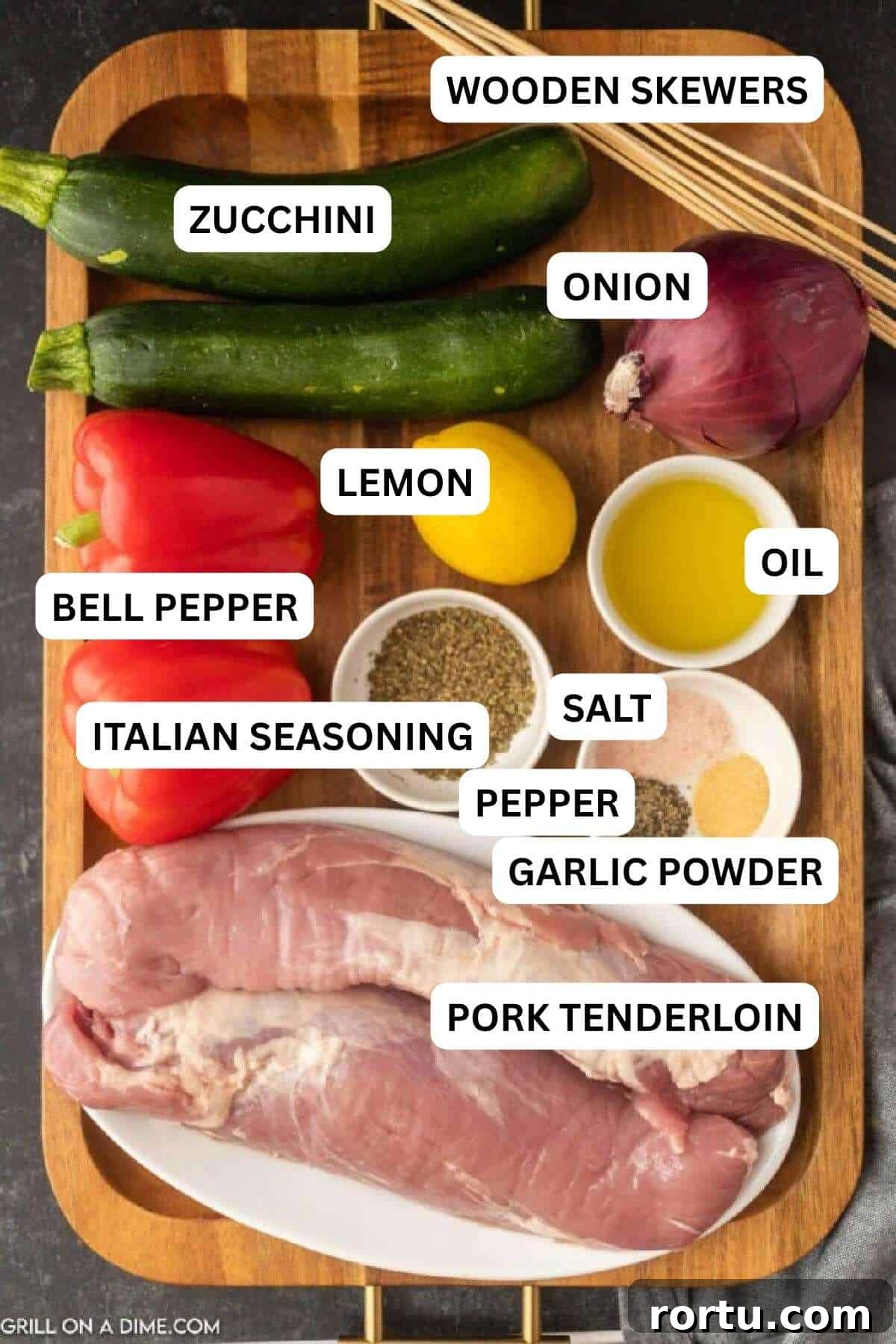 Ingredients needed to make recipe includes pork tenderloin, zucchinis, red onion, red bell peppers, italian seasoning, salt and pepper, garlic powder, olive oil, and lemon.