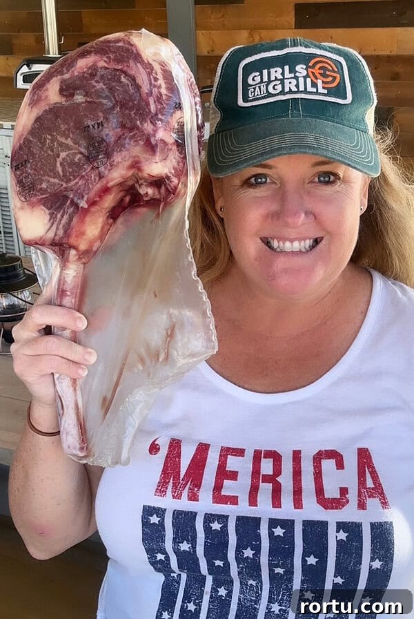 Smoked Baby Back Ribs on the Ninja FlexFlame Grill 14 Christie Vanover holding a raw steak.