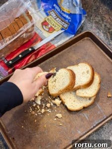 Bread being crushed to be made into breadcrumbs