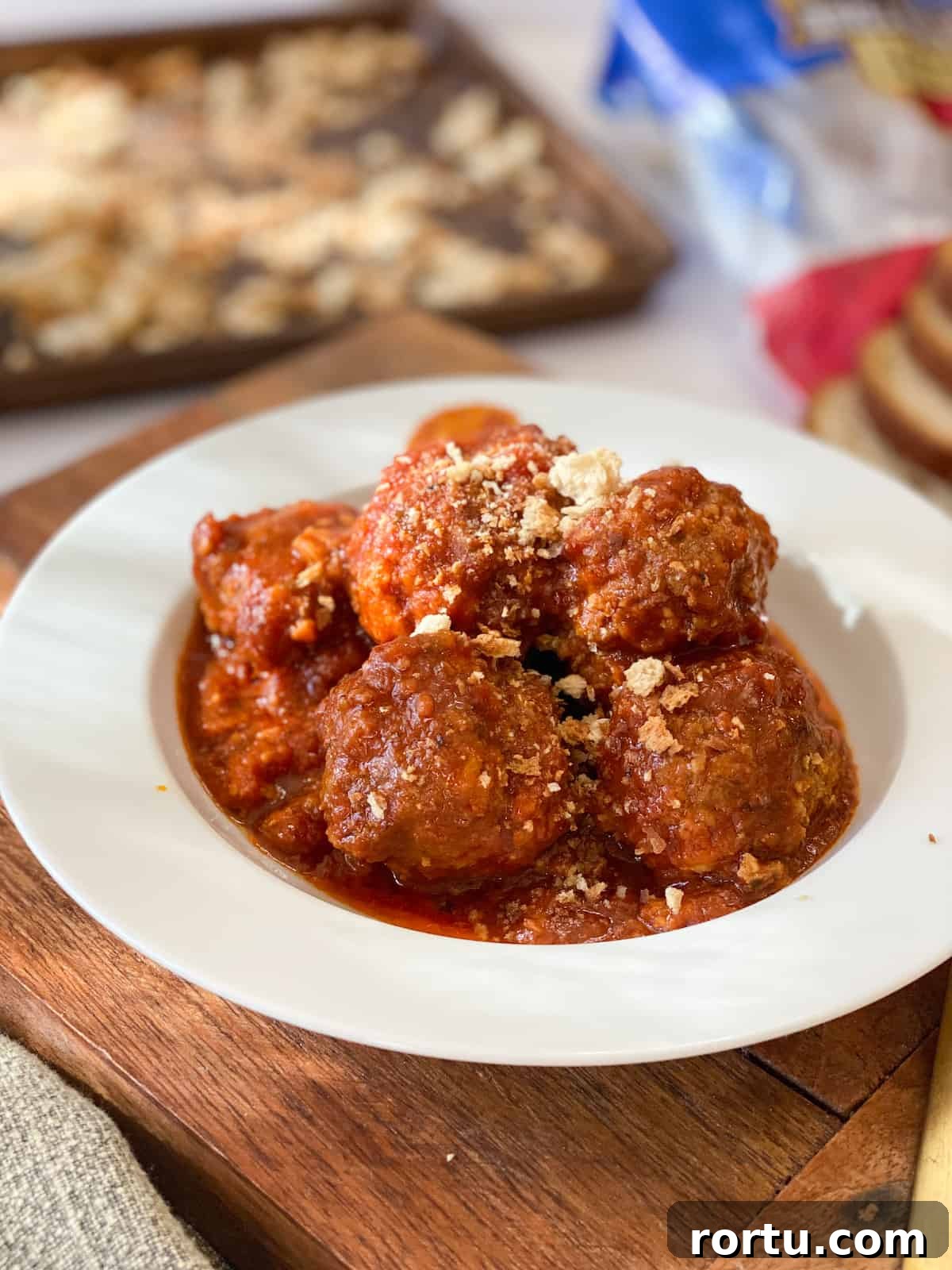 Easy Gluten Free Meatballs in a white bowl with breadcrumbs