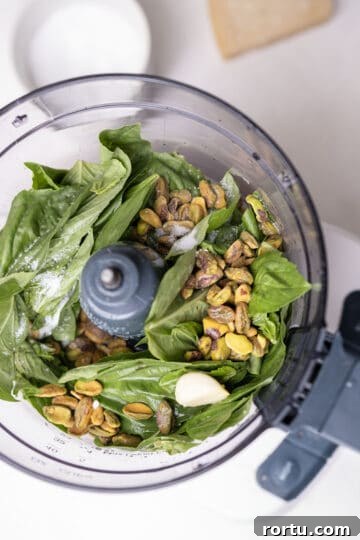 basil, pesto, garlic, salt, and lemon juice in a food processor